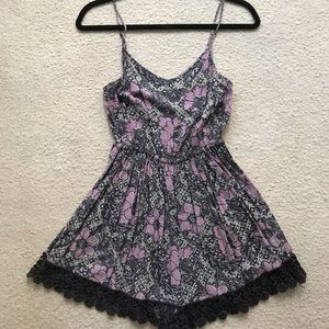 Fun floral LF romper in purple with crochet trim